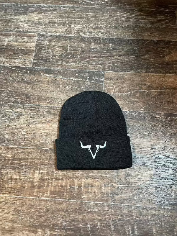 A black toque with a white yak logo embroidered on the front.